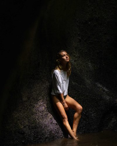 young-woman-waterfall-rock-bali-indonesia